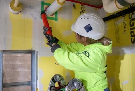 Yulissa Andrade EV Construction National Women in Construction Week Skilled Trades Painting Firestopping West Michigan Grand Rapids Holland